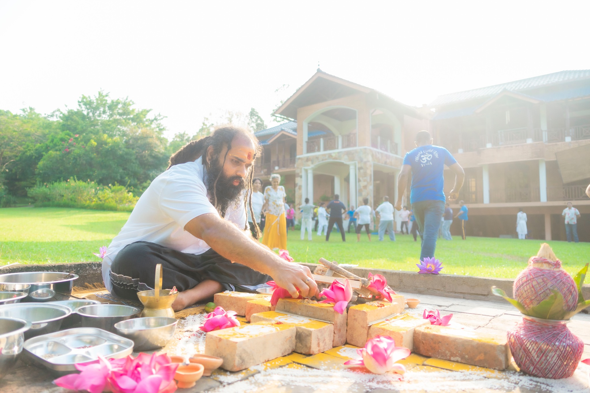 Rev. Chameera Sampath performing a sacred ritual with offerings.